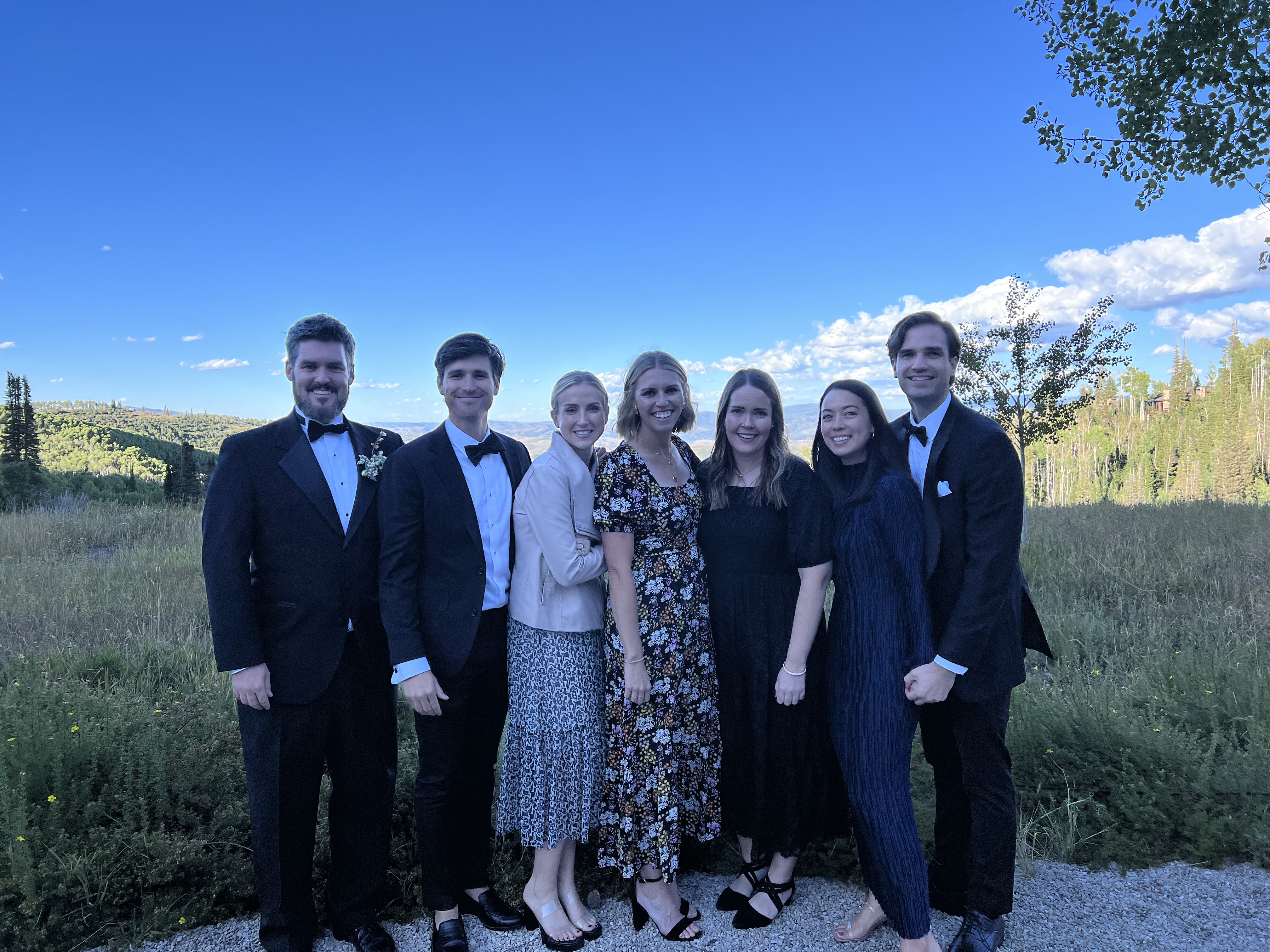 Mountain wedding crew — blue sky day
